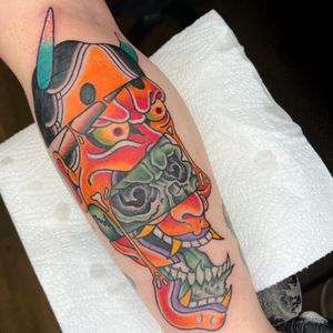Experience a fusion of traditional Japanese elements with a modern twist by artist Carlos Zucato on your lower leg.