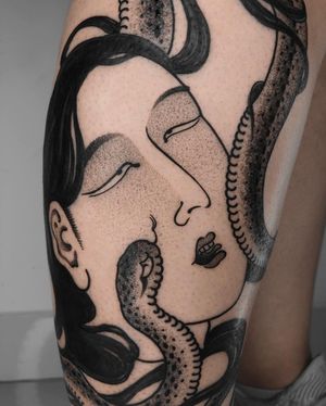 Blackwork and dotwork tattoo featuring a stunning design of a snake intertwined with a geisha and woman tattooed by FKM TATTOO.