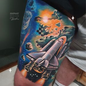 Explore the galaxy with this new school tattoo of a planet and rocket by Marek Unfamous Haras. Vibrant colors and detailed realism make this piece truly out of this world.