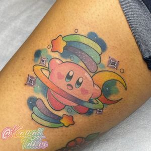 Kawaii Kirby and rainbows in space tattoo by Alexis Haskett