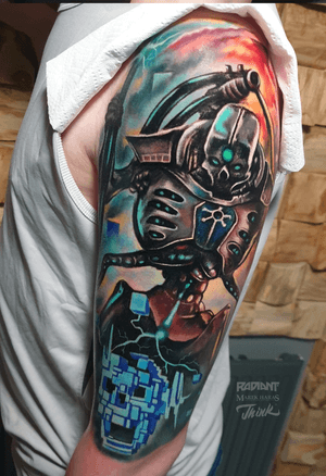 Get a futuristic anime robot tattoo on your upper arm done by the talented artist Marek Unfamous Haras in new school style.