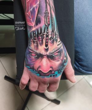 Vibrant new school style tattoo of a man on hand by Marek Unfamous Haras. Bold colors and intricate details make this piece pop.