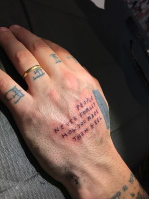 Get inspired with this small lettering quote tattoo on hand, beautifully done by the talented artist Jeff Huet.