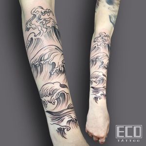 Capture the beauty of the sea with Lin Feng's intricate fine line black and gray waves and sealife forearm tattoo.