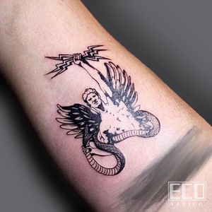 Experience the intricate beauty of a fine line tattoo featuring a snake and angel motif, expertly crafted by Lin Feng on your arm.