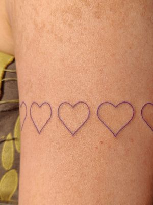 Experience love in a new light with this fine-line heart tattoo designed by the talented Mary Shalla.