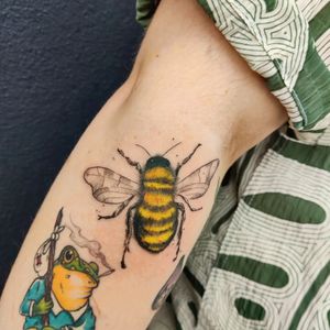 Experience the beauty of nature with this stunning realistic bee tattoo by acclaimed artist Mary Shalla.
