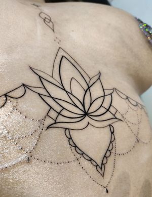 Delicate fine line flower design by Mary Shalla, perfect for under the boob placement. A beautiful and intricate piece of body art.
