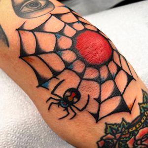 Get inked with a classic spider motif by Alessandro Lanzafame on your elbow. A bold statement piece for tattoo enthusiasts.