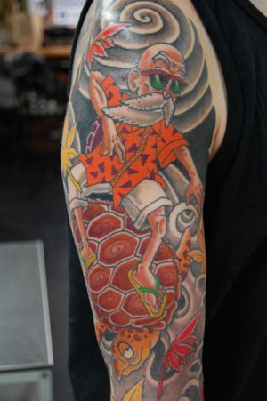 Express your love for anime with this unique turtle and man upper arm tattoo by Bananajims. Showcasing intricate details and vibrant colors.