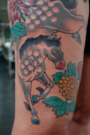 Get a stunning traditional horse tattoo on your lower leg by talented artist Bananajims. Embrace the beauty and strength of this majestic animal.