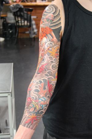 Get a stunning Japanese anime sleeve tattoo featuring a unique design of a turtle and a man, created by Bananajims.