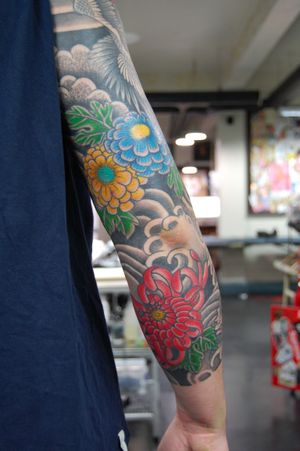 Elegant chrysanthemum flower tattoo by Bananajims, bringing traditional Japanese art to your sleeve. Perfect blend of beauty and culture.