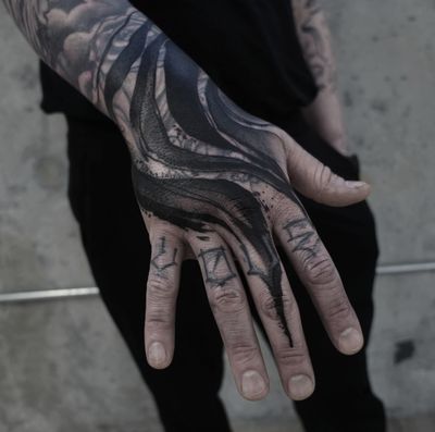 Unique blackwork pattern tattoo on hand by Rachel Aspe of Bellatrix Tattoo. Bold and intricate design.