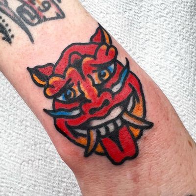 Experience the striking beauty of a traditional hannya mask tattooed on your forearm by Alessandro Lanzafame.