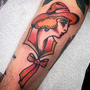 Capture the spirit of the wild west with this traditional style cowgirl tattoo by Alessandro Lanzafame, perfect for your forearm.