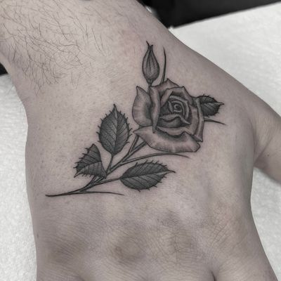 Fine line rose on the hand