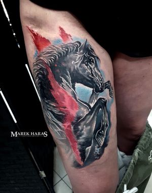 Experience the beauty and power of a detailed horse tattoo by Marek Unfamous Haras, expertly inked on your upper leg in a stunning realism style.