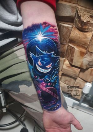 Anime new_school forearm tattoo featuring a unique blend of a planet and Gengar motif by Marek Unfamous Haras.