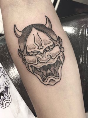 Experience the fierce beauty of a hannya demon in this stunning tattoo by Victor Martin. A bold statement for your forearm.