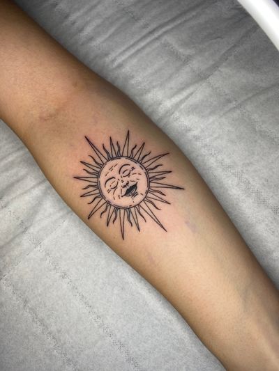 Beautifully intricate sun design on the forearm by Victor Martin, perfect for those who love minimalistic tattoos.