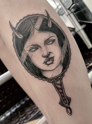 Get mesmerized by Victor Martin's stunning design of a vampire gazing into a mirror, beautifully rendered on your lower leg. Exude mysterious elegance with this neo-traditional masterpiece.