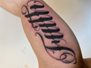 Get inspired by this beautiful lettering tattoo on your upper arm. Victor Martin's work will remind you to embrace each moment.