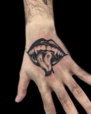Get a bold and vibrant sukuna mouth tattoo on your hand by Victor Martin, expert in neo-traditional style.