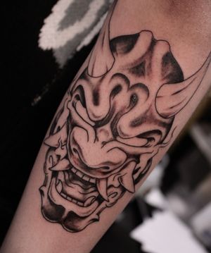 Get inked with a stunning hannya design by José, blending traditional Japanese style with modern black and gray techniques on your forearm.
