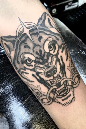 Experience the power and beauty of a majestic tiger in this striking black and gray neo-traditional tattoo by Victor Martin.
