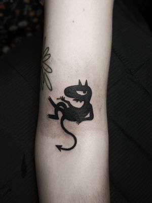 Neo-traditional blackwork tattoo of a devil symbolizing disenchantment by artist Luca Salzano on the forearm.