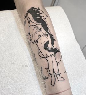 Immerse in the dreamlike world of Federico Colantoni's surrealism with this captivating woman tattoo on your forearm.