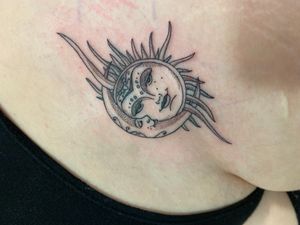 Experience the balance of light and dark with this stunning fine line sun and moon tattoo on your upper leg. By the talented artist Victor martin.