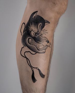 Experience the mystical allure of a Japanese blackwork wolf tattoo on your lower leg by the talented artist FKM TATTOO.