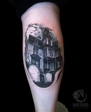 Admire the intricate detail in this black and gray house tattoo on lower leg by artist Alex Santo. A unique piece of architecture.