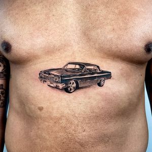 Experience the lifelike artistry of Martin Rosenberg with this micro-realism car tattoo. Admire the intricate details every day.