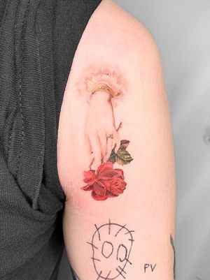 Experience intricate details of a realistic rose on hand, expertly crafted by Viola in micro realism style.