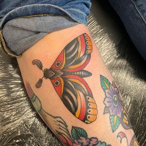 Capture the beauty of night with this traditional moth tattoo by Laurel, expertly placed on the lower leg. Timeless and stunning.