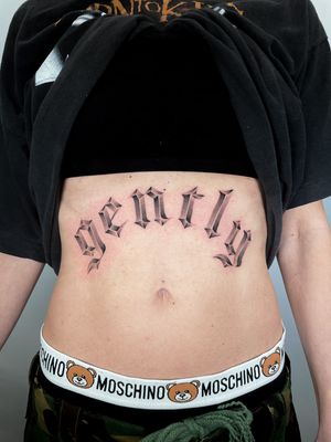 Get inspired with this stunning lettering quote tattoo by Martin Rosenberg, elegantly placed on the stomach.