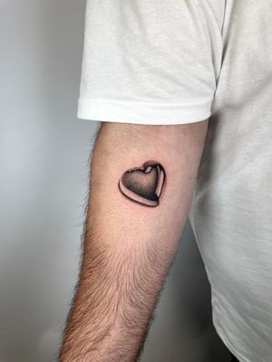 Elegant heart tattoo on arm, expertly done in dotwork and fine line style by talented artist Martin Rosenberg.
