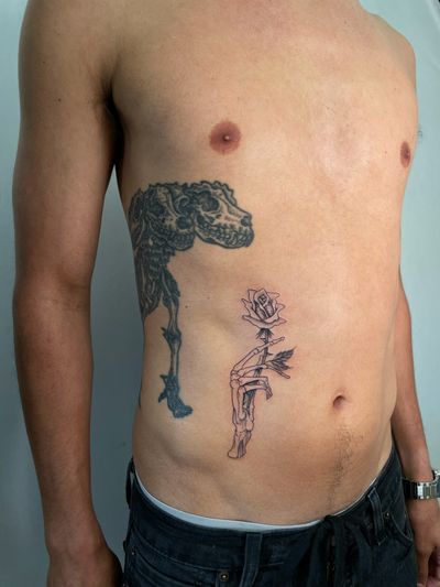 Elegant and intricate flower design tattooed on the stomach in fine line and ignorant style by talented artist Jeff Huet.