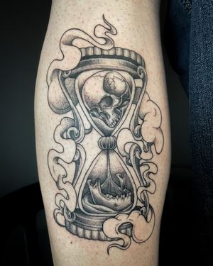 Unique dotwork and illustrative tattoo featuring a skull and hourglass motif by Kat Jennings.