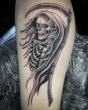 Gothic black and gray tattoo featuring a hauntingly beautiful reaper, expertly crafted by renowned artist Kat Jennings.