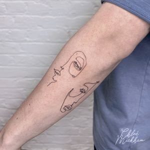 Get inked with Chloe Mickham's single-line design for a sleek and sophisticated look. Perfect for those who love minimalism.