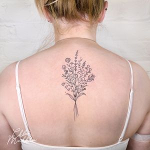 Adorn your skin with Chloe Mickham's intricate fine-line floral design featuring a beautiful bouquet motif.