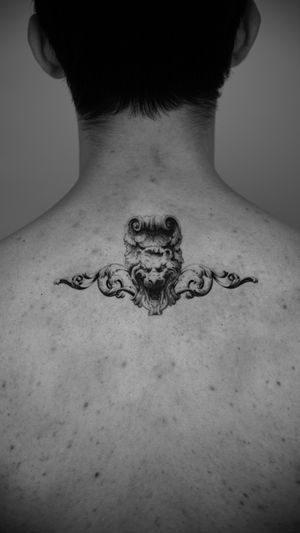 Experience the mystical charm of Viola's micro realism black and gray tattoo featuring a stunning gargoyle statue design.