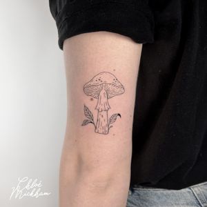 Get a fine line mushroom tattoo with intricate details done by the talented artist, Chloe Mickham.