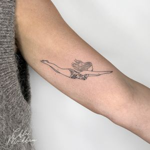 Get a stunning fine line tattoo of a graceful swimmer by Chloe Mickham. Perfect for those who love elegant and detailed designs.