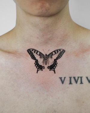 Gorgeous black and gray butterfly tattoo by Viola, exquisitely detailed with a touch of micro realism. Perfect for those seeking an elegant and subtle ink piece.