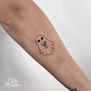 Capture the ethereal essence of a ghost with Chloe Mickham's fine line tattoo design. Delicate yet haunting, this piece is sure to mesmerize.
